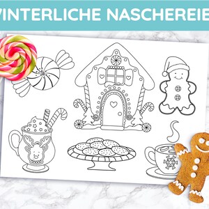 May include: A sheet with black and white illustrations of holiday treats, including a gingerbread house, gingerbread man, cookies, and hot cocoa. A colorful lollipop and a gingerbread man cookie are also present.