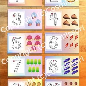 May include: Ten colourful cards with numbers 1 through 10. Each card has a number with dotted lines for tracing and a corresponding number of images. For example, the card with the number 1 has one cake, the card with the number 2 has two doughnuts, and so on.