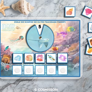 May include: A colorful underwater scene with a stingray, fish, and treasure chests. The game board includes a spinner with the number 5 and a section for counting treasures. The game is called "Z&auml;hle die Sch&auml;tze die du pro Tauchgang findest!" which translates to "Count the treasures you find per dive!"
