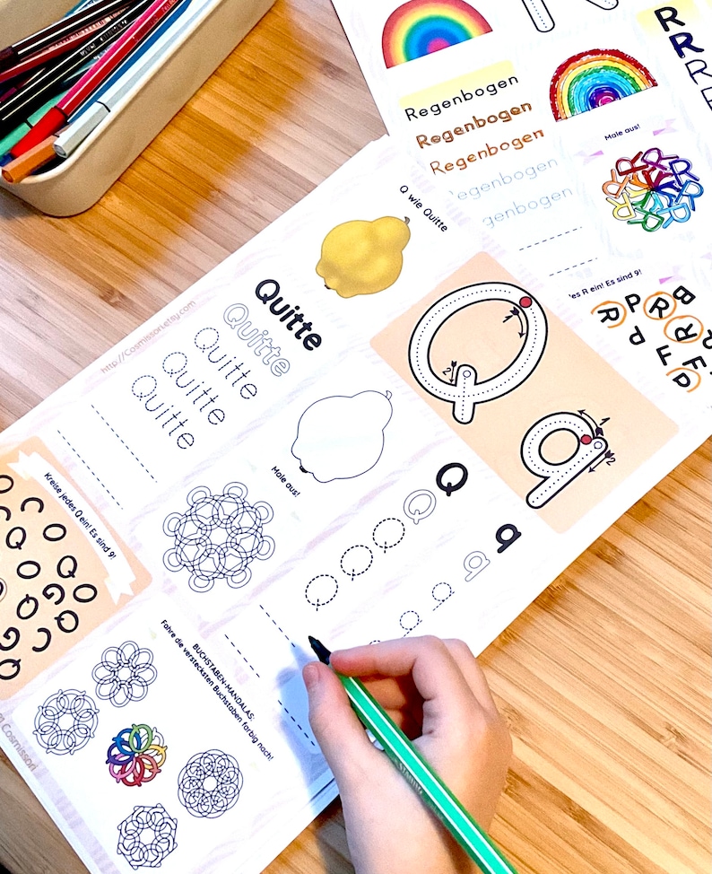 May include: A printable worksheet for learning the German alphabet. The worksheet features the letter Q, a picture of a quince, and a tracing activity for the letter Q. The worksheet also includes a mandala design to color.