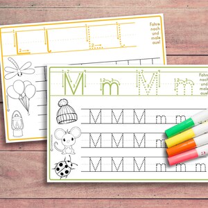 May include: A printable worksheet for learning the letter M. The worksheet features dotted lines to trace the letter M in uppercase and lowercase. The worksheet also includes pictures of a hat, a mouse, and a ladybug.