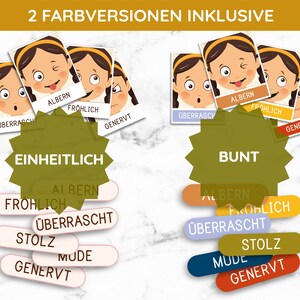 May include: Two sets of colorful emotion cards, one set with a solid background and one set with a colorful background. Each set includes four cards with different facial expressions: surprised, silly, happy, and annoyed. The cards are labeled with German words for each emotion: "&uuml;berrascht", "albern", "fr&ouml;hlich", and "genervt".