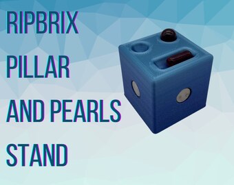 May include: A blue plastic stand with the words "RIPBRIX PILLAR AND PEARLS STAND" printed on the front. The stand has a small hole in the top and a slot on the side. A small blue ball and a red cylinder are in the stand.