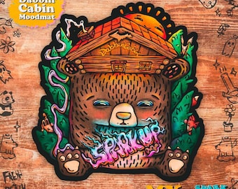 May include: A cartoon bear wearing a cabin on its head, with a pink and blue smoke cloud that says "Spark Up" coming from its mouth. The bear is sitting on a green and brown background with other cartoon animals and plants. The text "Dabbin' Cabin Moodmat" is in the top left corner of the image.