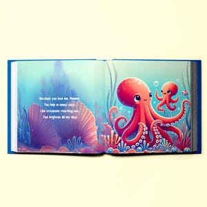 May include: An open book with a blue cover and colorful illustrations of two octopuses in a coral reef. The text reads "Because you love me, Mommy, You help in many ways. Like octopuses reaching out, You brighten all my days."