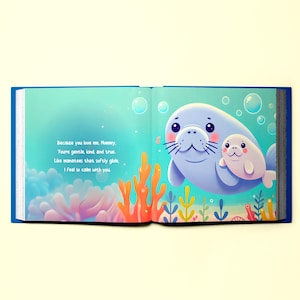 May include: An open book with a blue cover and colorful illustrations of a mother and baby manatee swimming in the ocean. The text on the page reads "Because you love me, Mommy, You're gentle, kind, and true. Like manatees that softly glide. I feel so calm with you."