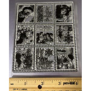 May include: Clear, rectangular stamp set with nine individual stamps featuring holiday-themed illustrations. Includes images of a deer, children, angels, snowflakes, and text such as "Deck the halls with boughs of holly" and "Let it snow."