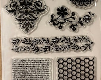 May include: Clear acrylic stamps with black decorative designs. Includes floral, geometric, and text patterns. Ideal for scrapbooking, card making, and other paper crafts.