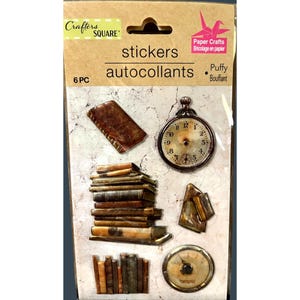 May include: A sheet of 6 puffy stickers featuring vintage book and clock designs. The stickers are labeled "stickers" and "autocollants".