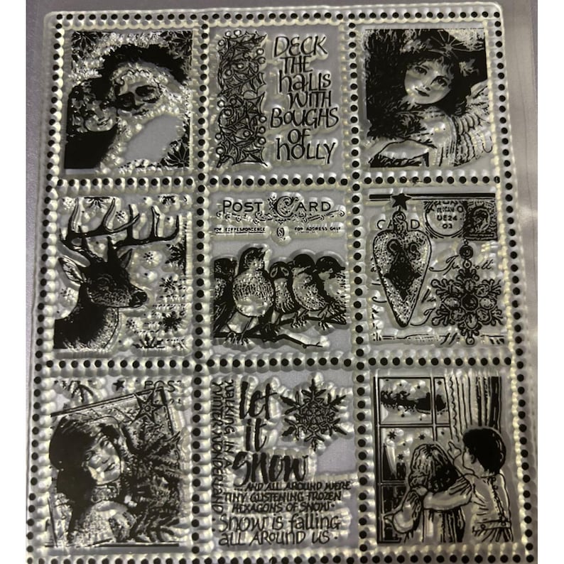 May include: Clear stamp set featuring Christmas-themed illustrations. Designs include Santa Claus, an angel, a deer, birds on a branch, a heart, a snowflake, and children looking out a window. Text includes "Deck the halls with boughs of holly" and "Let it snow".