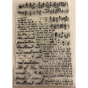 May include: Clear, rectangular stamp with musical notes and handwritten script. The script includes words like "graduation" and "brilliant." Ideal for crafting and scrapbooking projects.