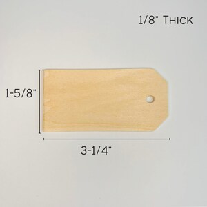 May include: A natural wood tag with a hole in the top. The tag is 3-1/4 inches wide and 1-5/8 inches tall. It is 1/8 inch thick.