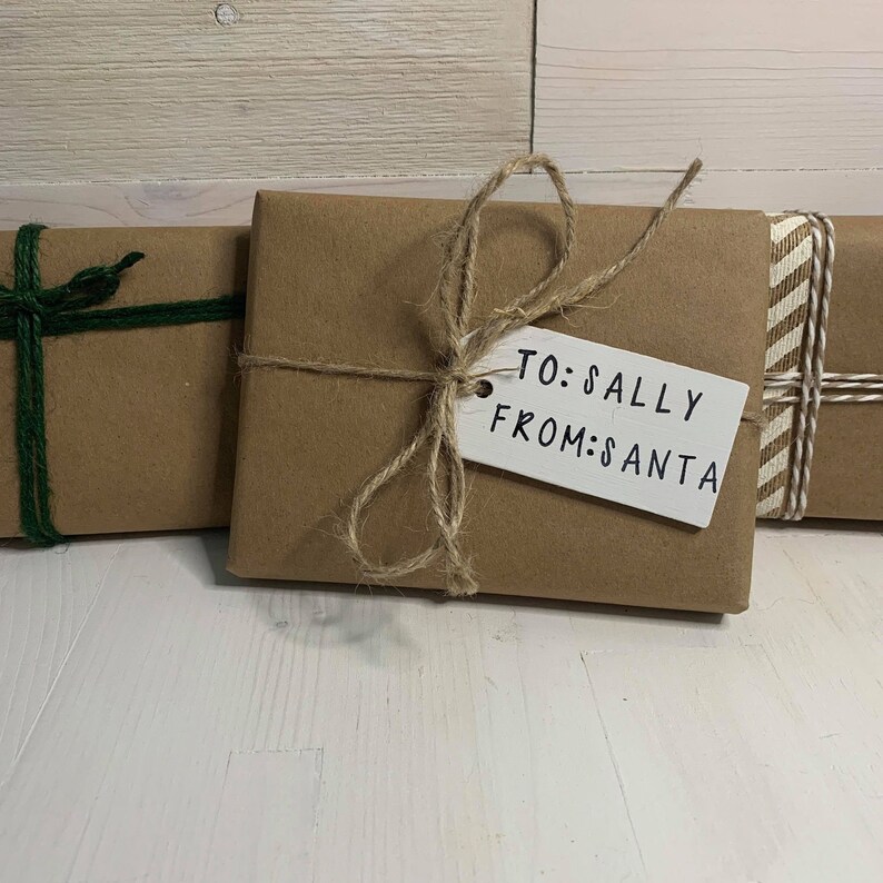 Additional example of blank wood tags for gift - decorated for Christmas present.