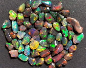 100 PCS AAA + QUALITY Ethiopian Opal Black Colour Polished Rough Natural Gemstone Electric Fire Top Quality Opal Polished Rough