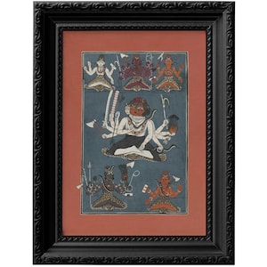 May include: A framed painting depicting a Hindu deity with multiple arms and heads, surrounded by other figures. The painting is on a blue background with red and gold accents.