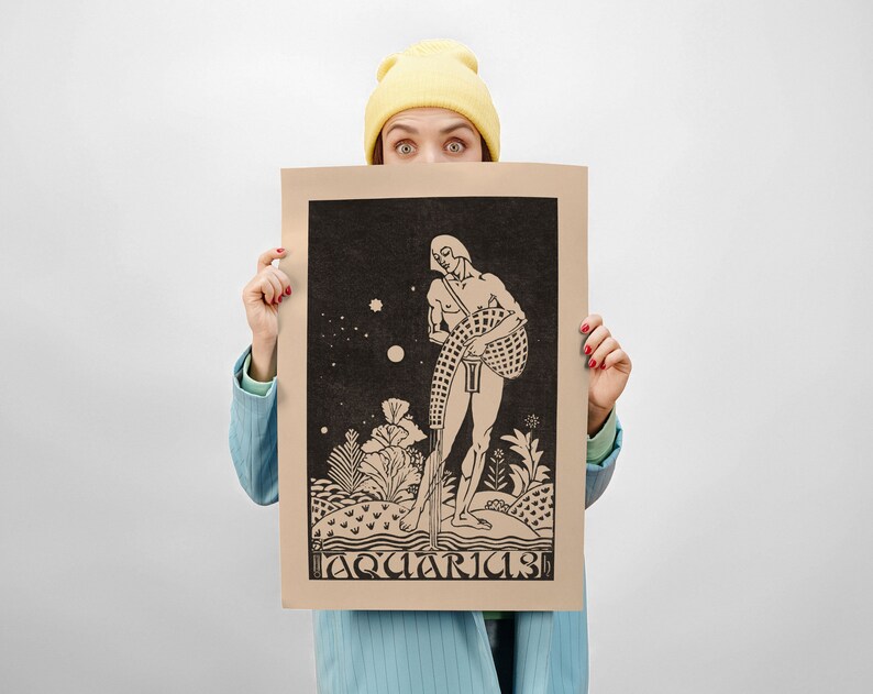 May include: A person is holding up a brown poster with a black and white illustration of a man holding a pitcher of water. The poster has the word "Aquarius" printed at the bottom.