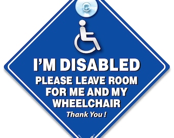 May include: A blue diamond-shaped sign with white text and a wheelchair symbol. The sign reads "I'M DISABLED PLEASE LEAVE ROOM FOR ME AND MY WHEELCHAIR Thank You!" A suction cup is attached at the top.