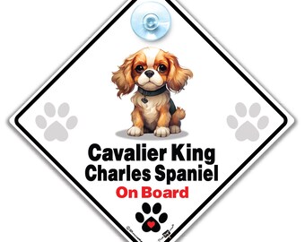 May include: White diamond-shaped car sign with a cartoon Cavalier King Charles Spaniel dog. The sign says "Cavalier King Charles Spaniel On Board" with a paw print and heart in the bottom corner.