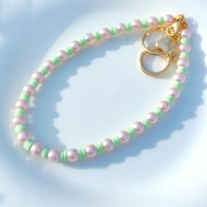 Pink. Pearl beaded phone charm/strap/wristlet