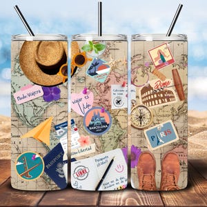 May include: Three stainless steel tumblers with a travel theme. Each tumbler features a different map with various travel-related images and text, including "Modo: Viajera", "viajar es Vida", "Barcelona", "Rome", "Paris", "CANCUN", "PASSPORT", and "LIBRE".