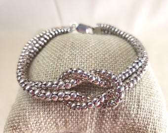 Pulsera Milor Italy de plata de ley 925 de dos hilos con nudo de palomitas de maíz.