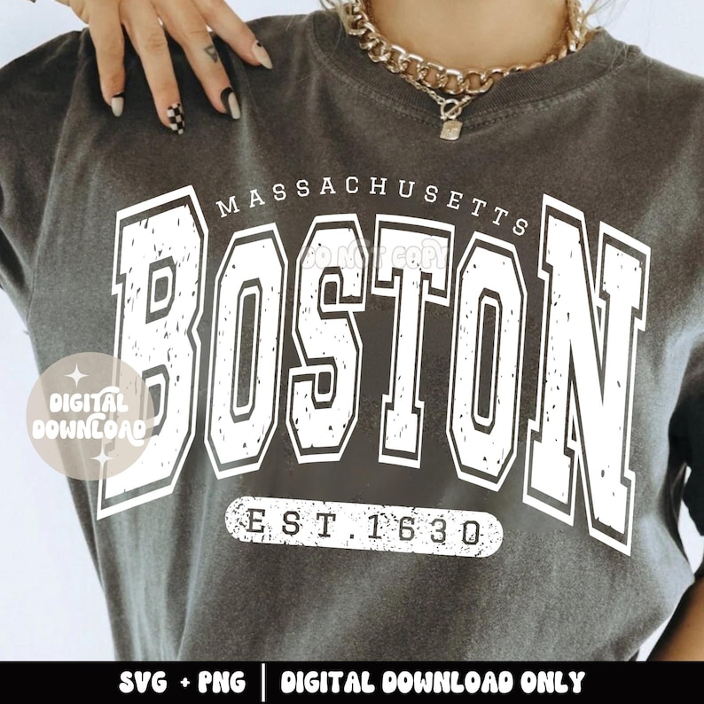 May include: A gray t-shirt with a white distressed graphic that says "Massachusetts Boston Est. 1630".