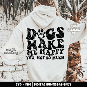 May include: White hoodie with black text that reads "Dogs make me happy you, not so much". The text is in a distressed font with a paw print and heart in the word "Dogs".