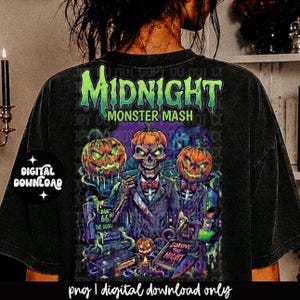 May include: A black t-shirt featuring a graphic print with the text Midnight Monster Mash. The design includes a central skeleton figure with a pumpkin head, flanked by two additional pumpkin-headed figures, all wearing suits and bow ties.