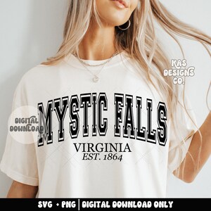 May include: White t-shirt with black text that reads "MYSTIC FALLS VIRGINIA EST. 1864". The text is in a varsity style font.