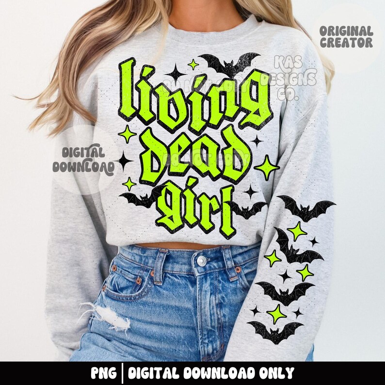 May include: A light gray sweatshirt with the text "Living Dead Girl" in neon green, with black bats and stars. The sweatshirt is paired with blue jeans. The image also includes the text "Digital Download Only".