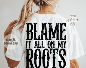 May include: A white t-shirt with a black distressed graphic that reads "Blame it all on my roots".