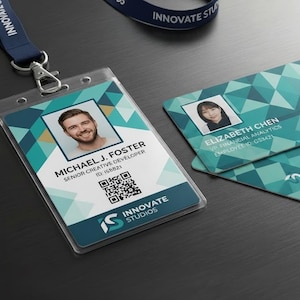 May include: A vertical ID badge in a clear plastic holder attached to a navy blue lanyard with the text INNOVATE STUDIOS, alongside two horizontal ID cards. All cards feature a teal and white geometric pattern, a QR code, and company branding.