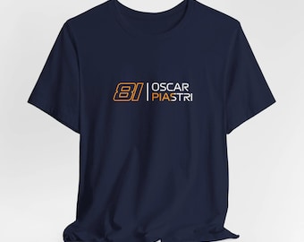 May include: A navy blue t-shirt with the number "81" in orange and the text "OSCAR PIASTRI" in white.