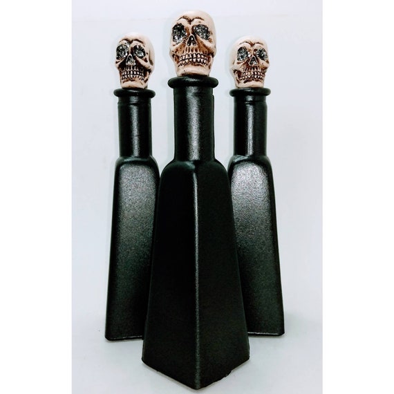 3 Bottles with Ceramic Skull Stoppers