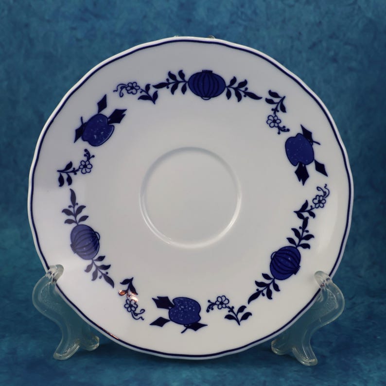 May include: A set of three ceramic mugs with a speckled, matte finish. The mugs are in shades of cream, light gray, and dark gray. Each mug has a simple, minimalist design, perfect for coffee or tea.