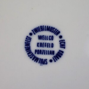 May include: A set of three ceramic mugs with a speckled, matte finish. The mugs are in shades of cream, light gray, and dark gray. Each mug has a simple, minimalist design, perfect for coffee or tea.