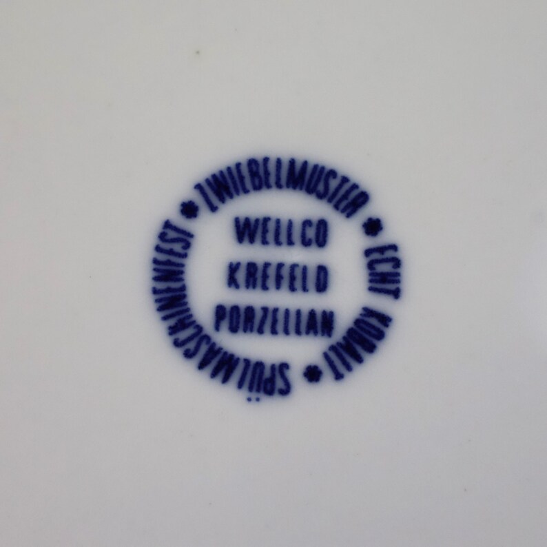 May include: A set of three ceramic mugs with a speckled, matte finish. The mugs are in shades of cream, light gray, and dark gray. Each mug has a simple, minimalist design, perfect for coffee or tea.