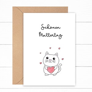 May include: A white card with the text "Sch&ouml;nen Muttertag" and a cartoon white cat holding a pink heart. The cat is surrounded by small pink hearts.