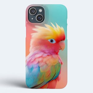 May include: A colourful phone case featuring a pink, yellow and blue parrot against a gradient background.