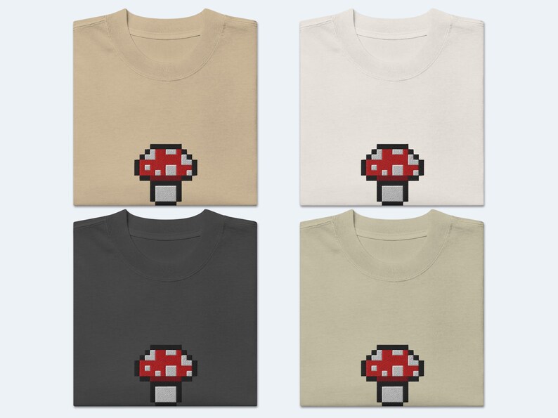 May include: Four t-shirts in different colors, each featuring a pixelated red and white mushroom graphic.
