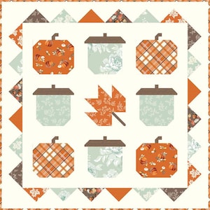 May include: A fall-themed quilt featuring pumpkin and acorn shapes in orange, brown, and teal. The quilt has a cream-colored background with a border of triangles and floral patterns. The pumpkins have various patterns, including plaid and floral designs.