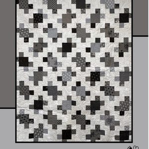 May include: Black and white quilt pattern with a "Puzzled" title. The quilt is made up of a repeating pattern of plus signs. The quilt is made by Molly Cook for Villa Rosa Designs.