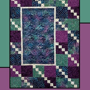 May include: A quilt pattern called "Morning Spring" by Molly Cook for Villa Rosa Designs. The quilt features a patchwork design with a variety of fabrics in shades of purple, blue, green, and white. The center of the quilt is a large square of fabric with a floral pattern.