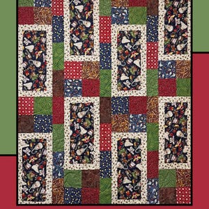 May include: A quilt pattern called "Sugar Cookies" by Heidi Cook for Villa Rosa Designs. The quilt features a patchwork design with various shades of red, green, brown, and blue. The pattern includes a repeating design of rectangles and squares.