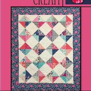 May include: A quilt pattern called "Raspberry Cream" by Villa Rosa Designs. The quilt features a white background with a repeating pattern of pink, blue, and gray triangles. The quilt is surrounded by a border of blue fabric with a floral pattern.