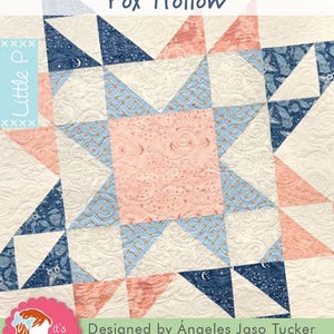 May include: A quilted star pattern in shades of cream, pink, and blue. The design features the text "Fox Hollow" and "Designed by Ángeles Jaso Tucker". The quilt has a detailed, textured surface with intricate stitching.