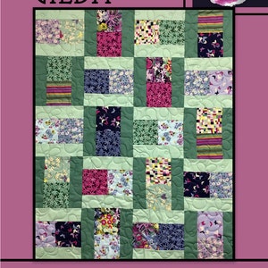 May include: A quilt pattern called "Gilda" by Villa Rosa Designs. The quilt is made up of a grid of squares with different floral and geometric patterns in shades of pink, green, blue, and white. The quilt is surrounded by a border of floral and butterfly motifs.