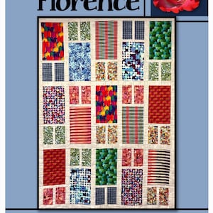 May include: A quilt pattern called "Florence" by Villa Rosa Designs. The pattern features a grid of colorful squares with different geometric patterns. The quilt is made with a variety of fabrics, including red, green, blue, and yellow.
