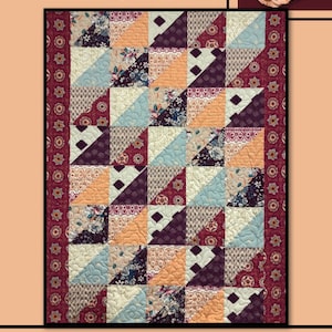 May include: A patchwork quilt titled "Hanover" with a geometric design. The quilt features squares of various patterned fabrics in shades of burgundy, peach, cream, and blue. The border is a burgundy floral print. The words "Villa Rosa Designs" are at the bottom.