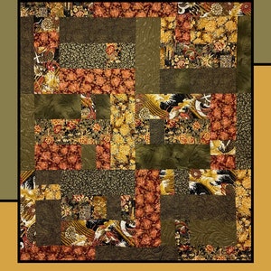 May include: A quilt pattern called "Egg Rolls" by Heidi Cook for Villa Rosa Designs. The quilt is made up of squares of fabric in shades of green, brown, and gold. The fabric has a floral pattern.
